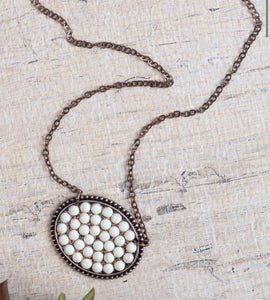 Bumpily Bamboozled Bronze Necklace With A Beaded Pendant